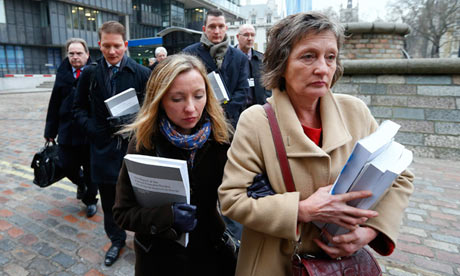Geraldine Fimucane, Pat Fimucane's widow leads her family into court in Belfast to challenge David Cameron's refusal to hold the promised public inquiry into her husband's assassination