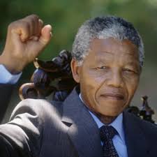 Mandela flourishes a revolutionary's fist