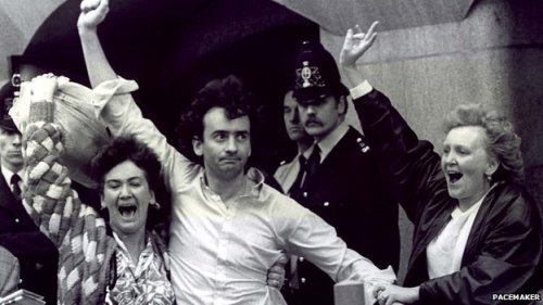 Gerry Conlon celebrates his acquittal outside the Old Bailey with his two sisters in 1989. Notice the unhappy-looking policemen in the background.