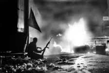 The iconic photo of Joe McCann, taken by an Irish Times photographer, in ELiza St in the Markets on the night of internment, Aug 9th, 1971.