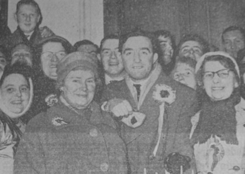 Boal celebrates his election to Stormont as the MP for Shankill. His constituency took in the Court Ward, which some regard as the birthplace of the Gusty Spence UVF. Boal's more radical stance on social and economic issues reflected the area's disregard for 'fur-coat Unionism', its traditional support for Independent Unionism and the subsequent development of the Progressive Unionist Party, the UVF's political wing which embodied many of these