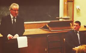 Judge Seamus Treacy address a human rights conference as Pat Finucane's son, Michael listens....